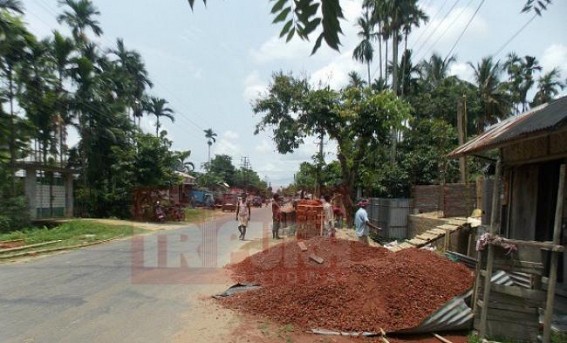 Kamalpur: Construction material heaped by footpath disrupting traffic movement, role of Panchayat under scanner Kamalpur: Construction material heaped by footpath disrupting traffic movement, role of Panchayat under scanner